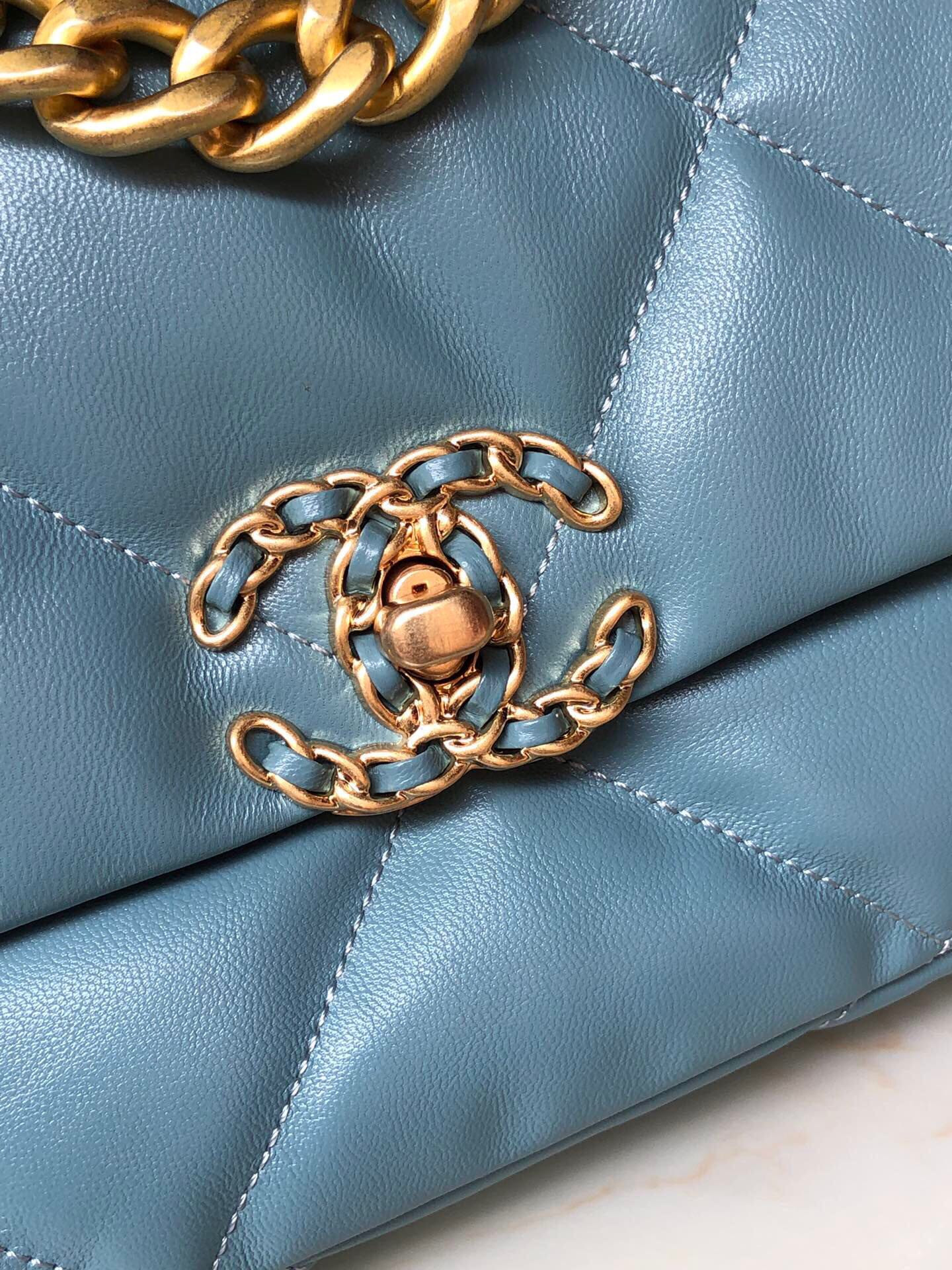 Ch*el 19 handbag shiny leather, gold-tone, silver-tone & ruthenium-finish metal blue 6.2 × 10.1 × 3.5 in